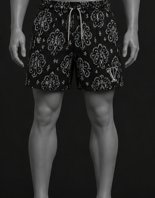Mannequin wearing black patterned shorts on a black background